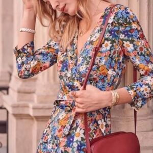 Sézane Nadia dress in the meadow print, featuring a wrap-around neckline, three-